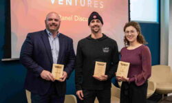 Homegrown Ventures conference with speakers Gus Minor, Dylan Lloyd, and Hilary Deverell holding plaques