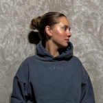 summer company participant solace supply with a woman in a hoodie