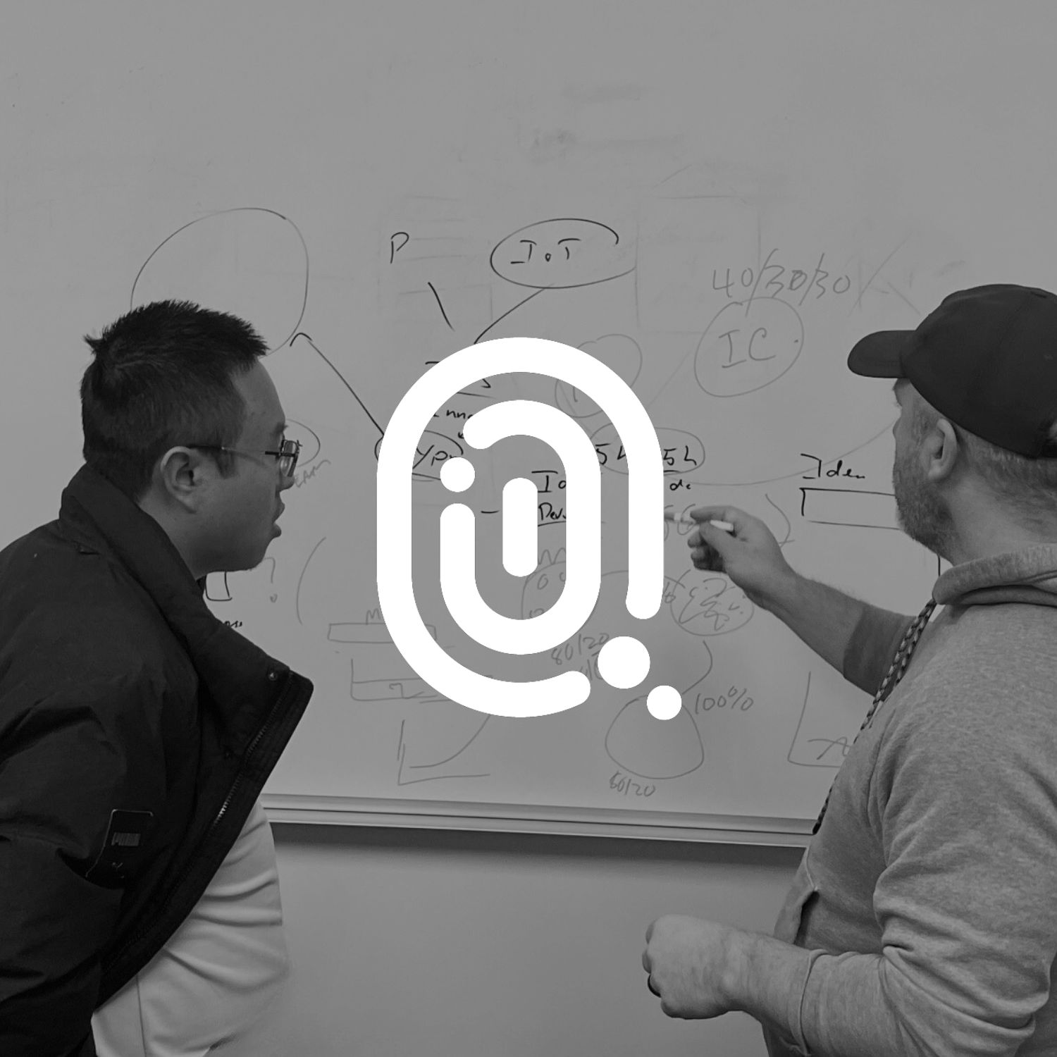 incubator program logo over an image of a mentor and participant writing on a white board