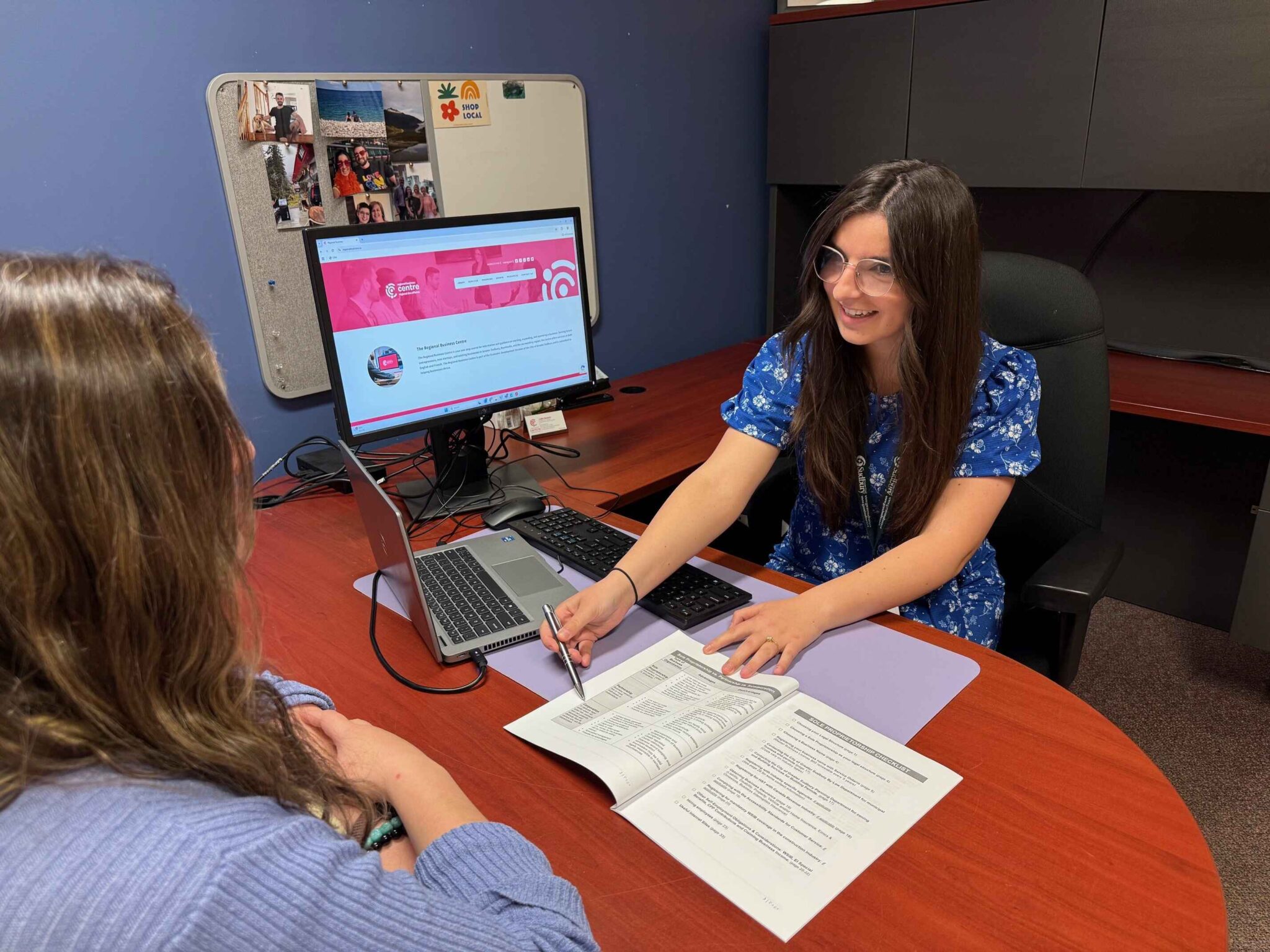 Caitlin Thomson working at her desk