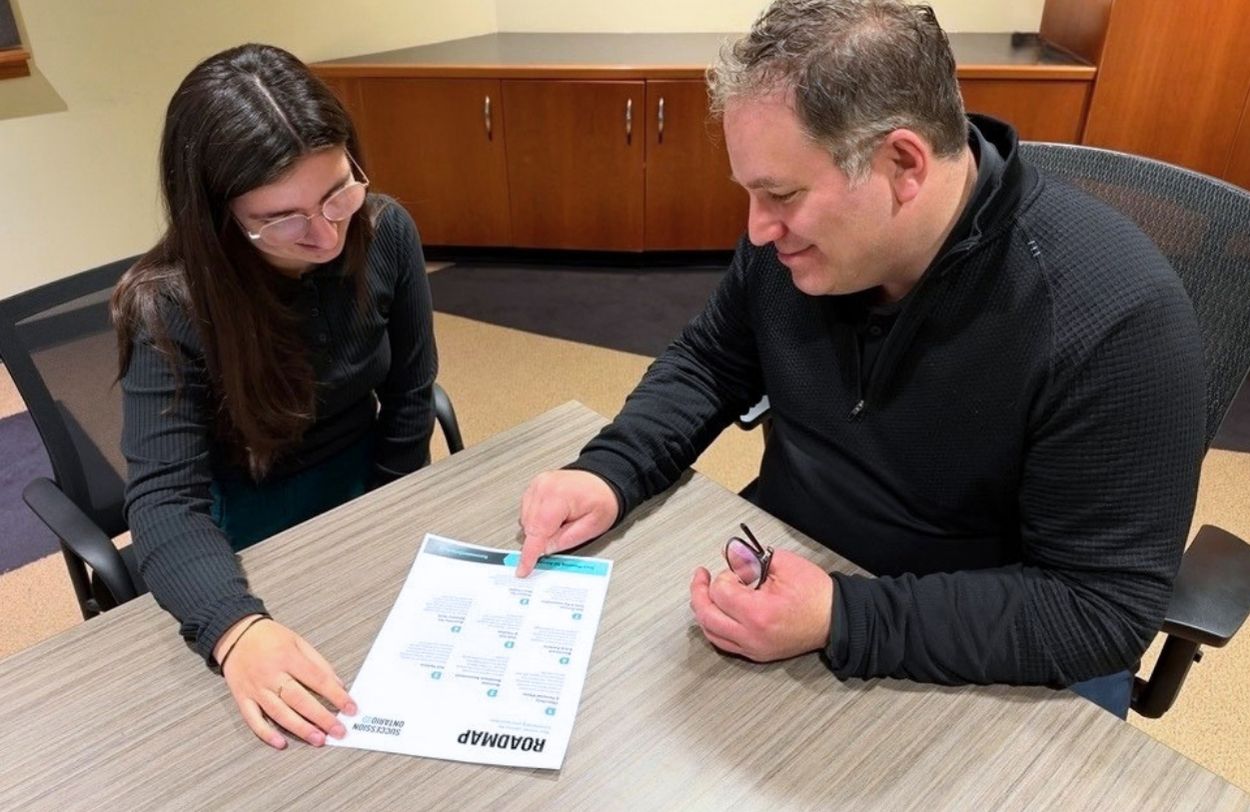 man and woman advisors meeting about succession planning